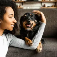 3.-Woman-with-pet-dog-on-sofa-200x200